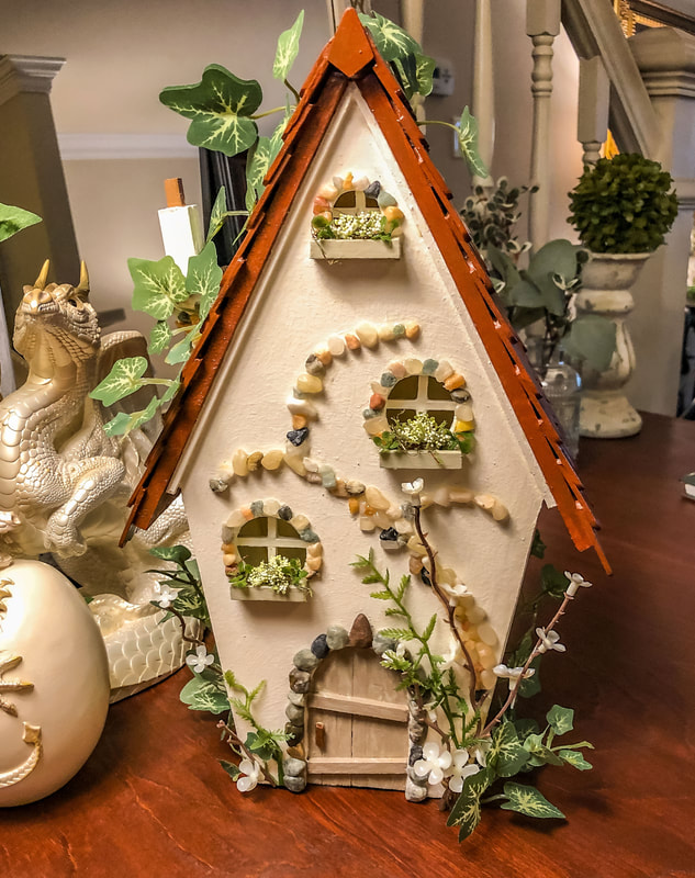 Handcrafted wood fairy cottage with faux ivy.