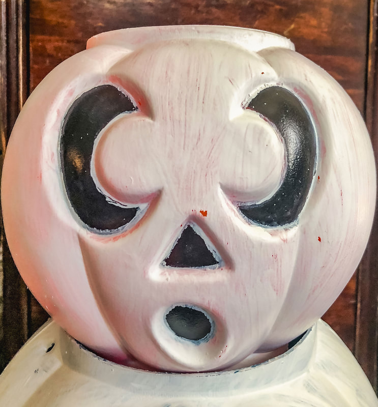Halloween candy bucket painted white.