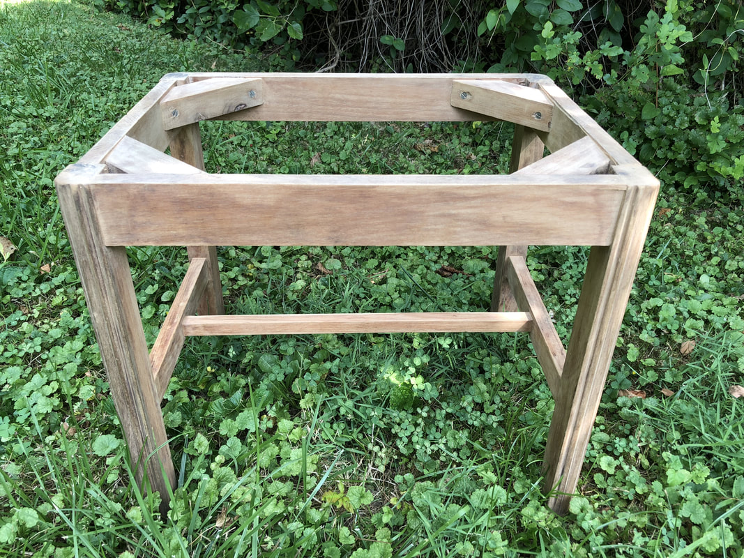 Wood frame of vintage stool stripped before staining.