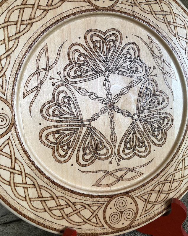 Hand drawn wood burned shamrock artwork by Di's Studio Designs.