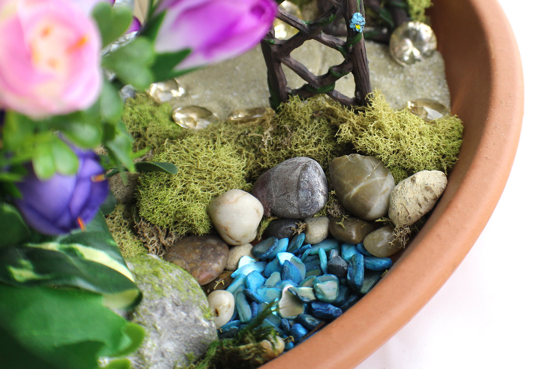 Closeup of an indoor fairy garden.