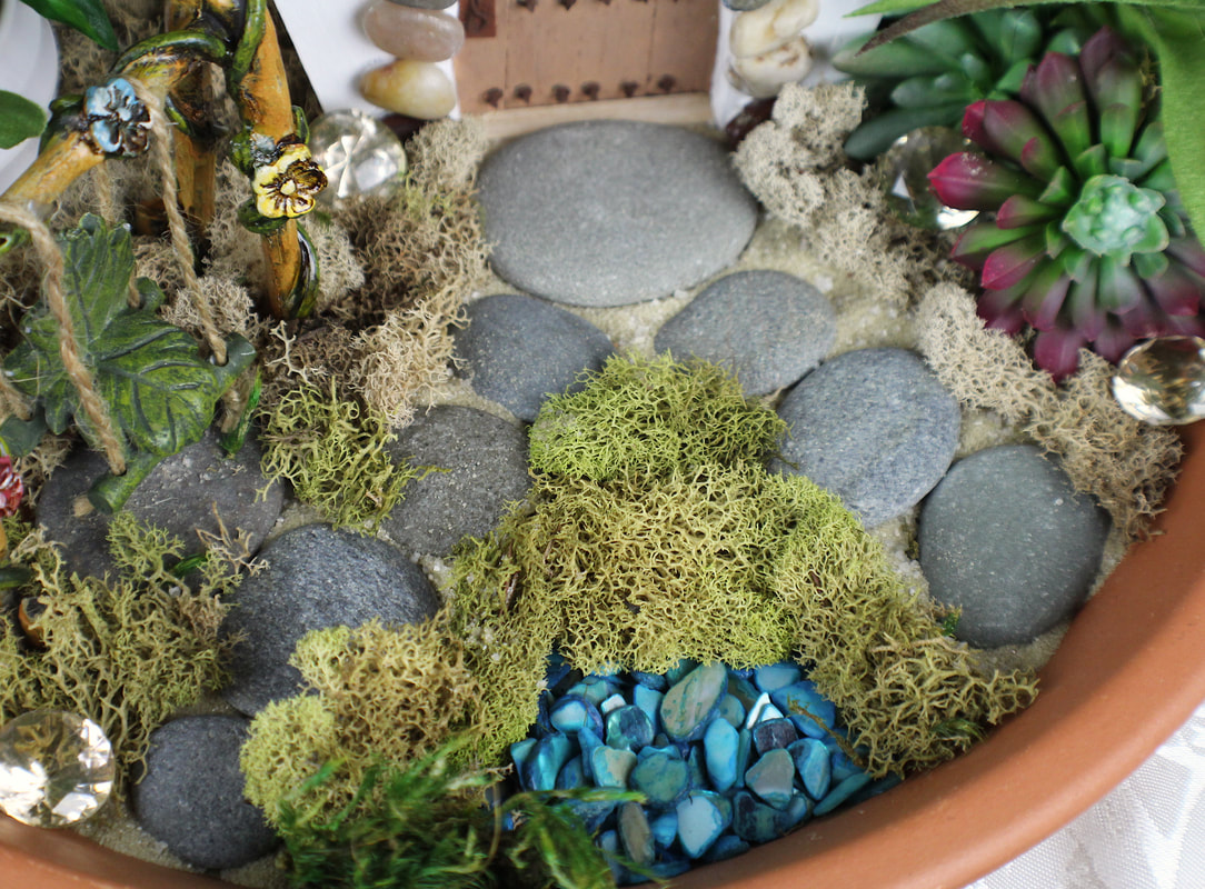 Closeup of pathway in an indoor fairy garden