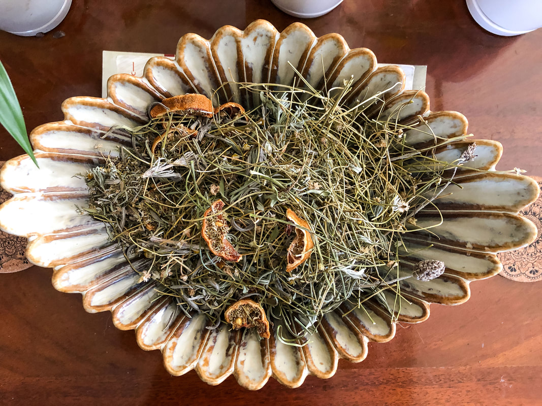 Homemade lavender, chamomile, and lemon potpourri in a decorative bowl.