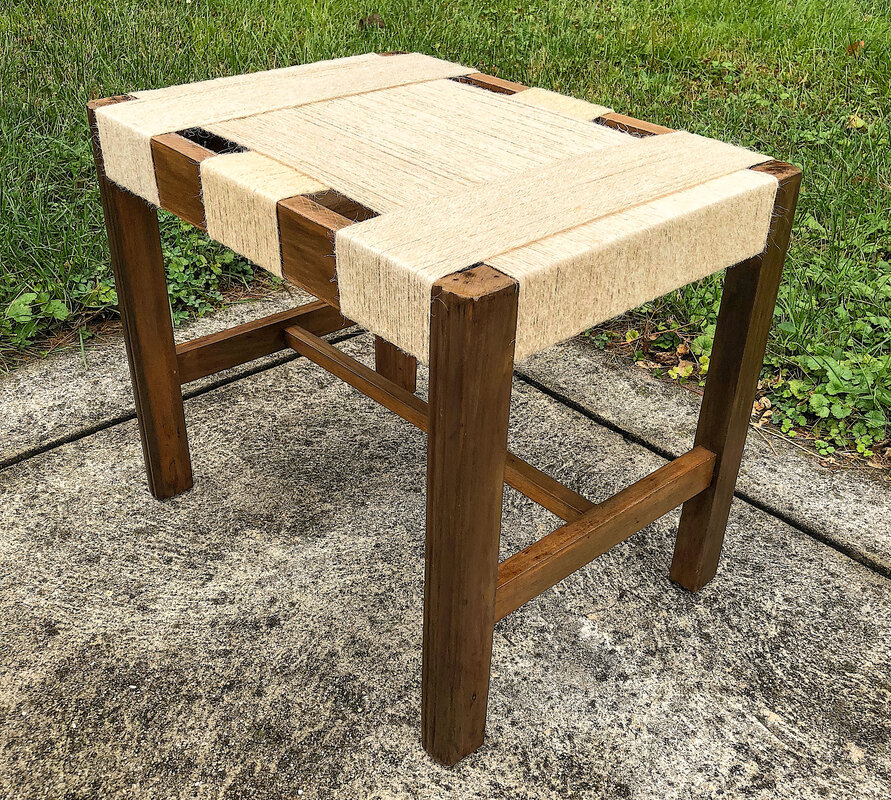 Repurposed stool wrapped in jute twine.