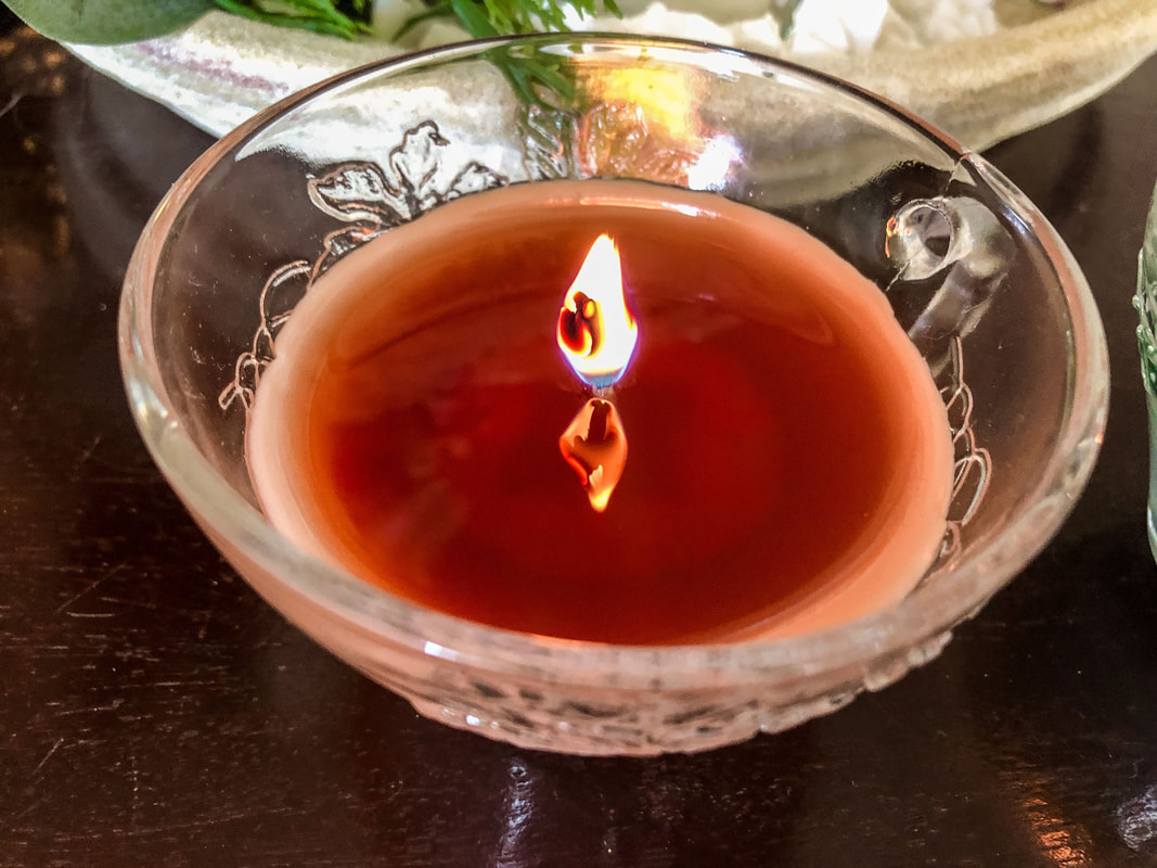 Burning a homemade candle with a hazelnut fragrance. 