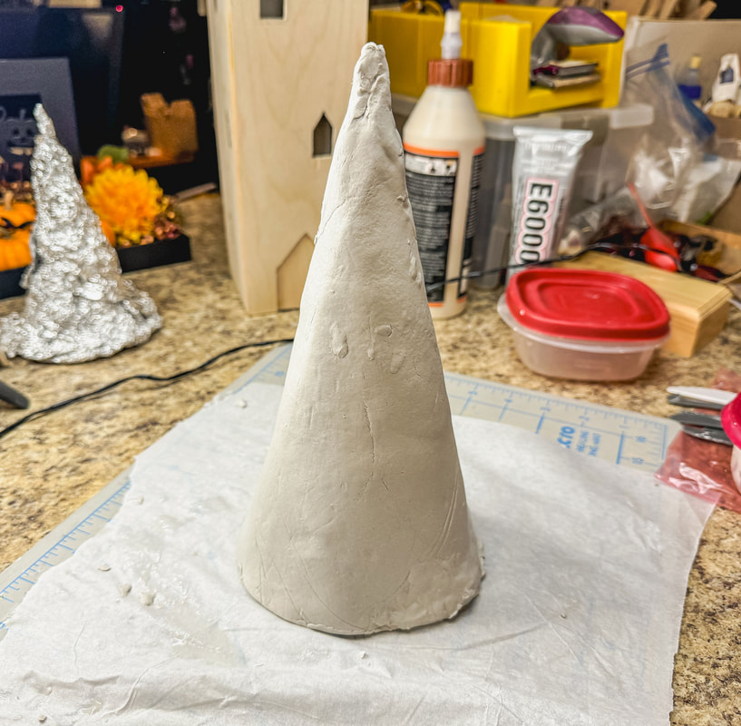Conical roof made with air-dry clay.