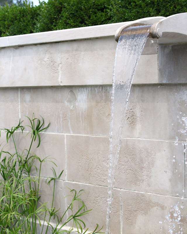 Water fountain from a wall in Longwood Gardens Pennsylvania