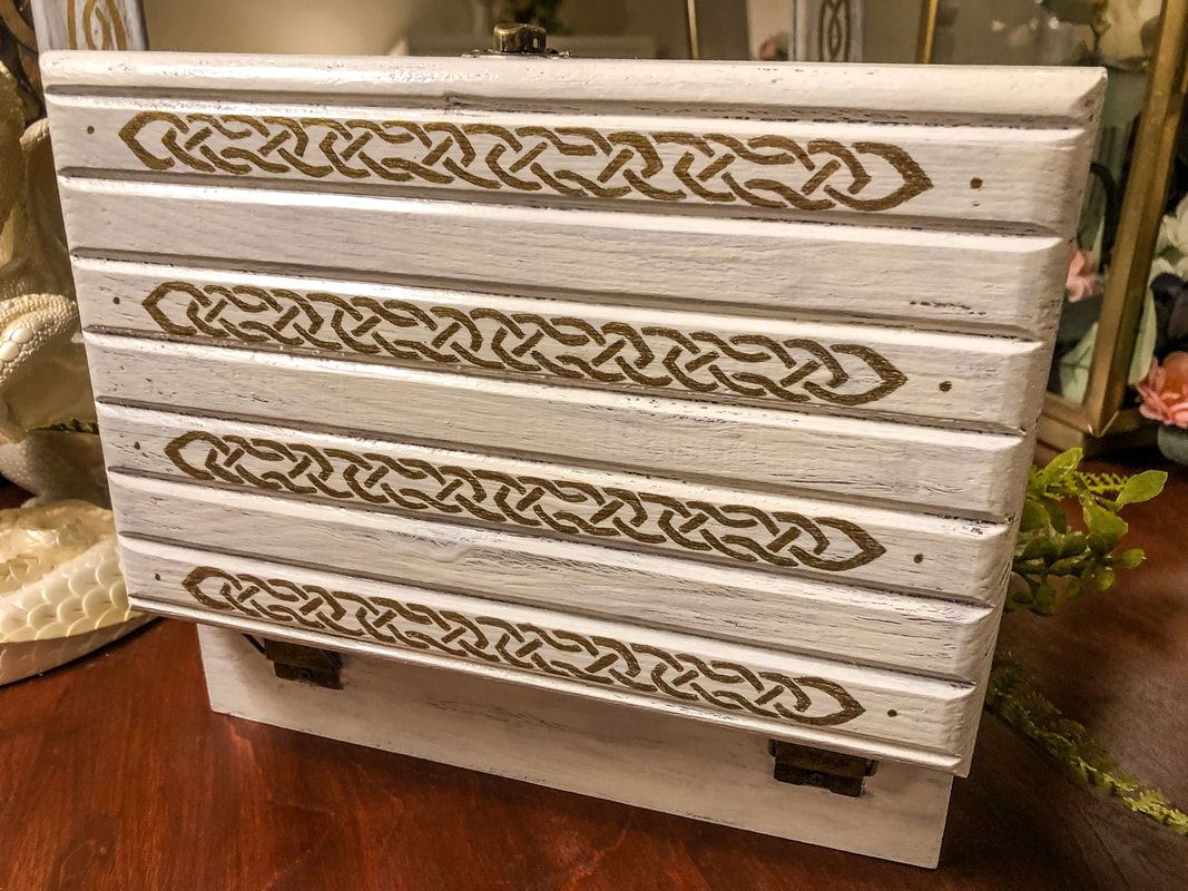 Hand painted box with Celtic knots on lid. 